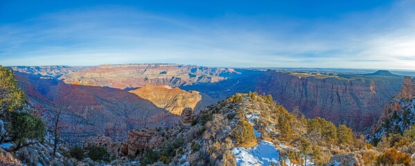 Wide Grand Canyon panorama with snowy rim