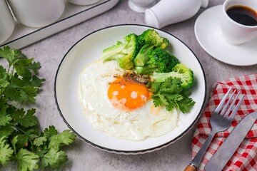 Fried egg with Broccoli and black coffee for morning breakfast