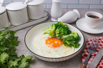 Fried egg with Broccoli and black coffee for morning breakfast
