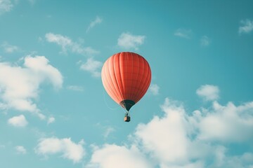 Fototapeta premium Bright Red Hot Air Balloon in Blue Sky