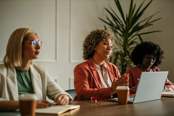 Businesswomen listening attentively during a meeting in the office