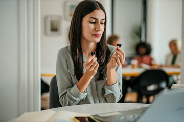 Businesswoman choosing right size earbud for comfortable listening experience
