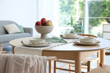 Stylish table setting, chairs and decor in dining room