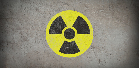 Yellow radioactive sign on grey stone background, banner design. Radiological pollution