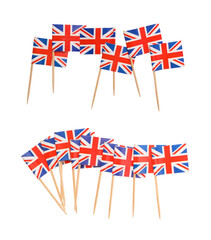 Small paper flags of United Kingdom isolated on white, set