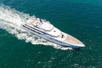 Sea boat go to yacht marina. Yachting and boating marina. Yacht boat sailing. Aerial view luxury motorboat in sea. Summer sea vacation. Boat trip. Luxury lifestyle and traveling. Elegant vessel