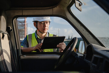asian male engineer working in construction site for bridge