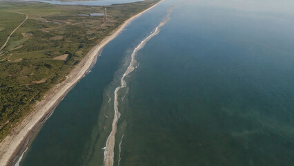 River delta meeting the sea, taken from drone