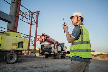 asian male engineer working in construction site for bridge