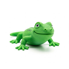 Obraz premium A toy green rubber lizard isolated on white