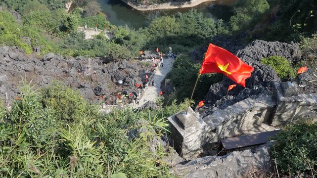 Stone Path to the Top of Mua Caves in Ninh Binh Vietnam with National Flags and Mountain View