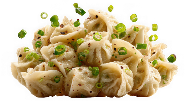 Delicious pile of steamed dumplings garnished with fresh green onions isolated on transparent background