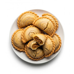 Fototapeta premium A plate of curry pastries isolated on white