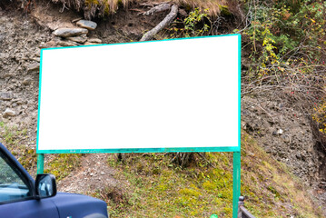 a large information board with a white background for text at the entrance to a mountain reserve or park