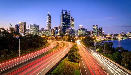 Fototapeta premium City skyline at twilight with a highway