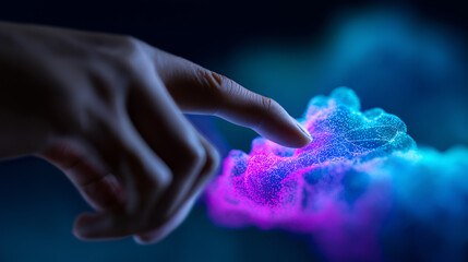 A human hand reaches out to touch an abstract, glowing cloud made of blue and pink particles, symbolizing cloud computing or AI interaction.
