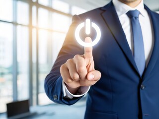 Businessman touches glowing power button symbol initiating a new venture or project