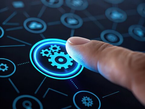 Finger presses glowing gear icon on futuristic digital interface representing automation and technology