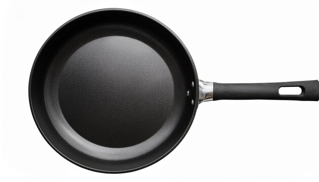 frying pan presented with a top view displays its sleek black silhouette against transparency