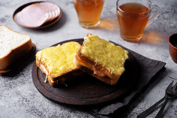 Ham cheese sandwich on a wood plate