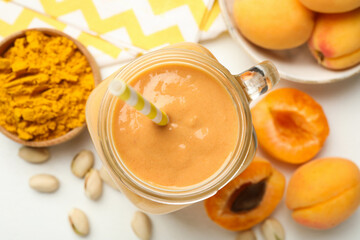 Superfood. Tasty smoothie and ingredients on white table, flat lay