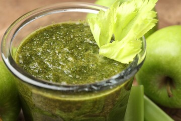 Superfood. Tasty smoothie in glass and ingredients on table, closeup