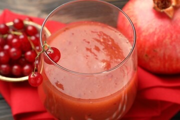 Superfood. Tasty smoothie in glass and ingredients on table, closeup