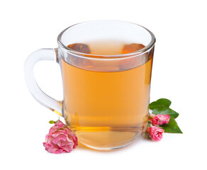 Aromatic tea in glass cup, roses and green leaves isolated on white