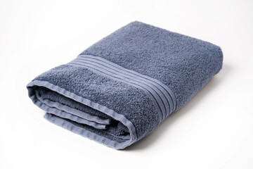 Folded bath towel isolated on white background