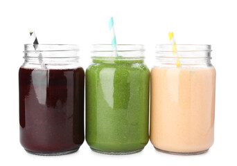Superfood. Different tasty smoothies in mason jars isolated on white
