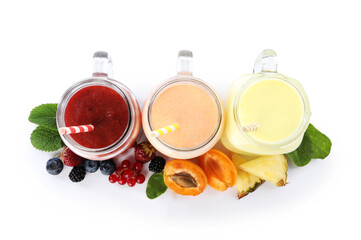 Superfood. Different tasty smoothies in mason jars and ingredients isolated on white, top view