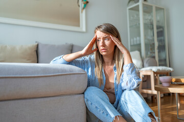 Tired Woman Sitting Alone at Home During a Stressful Afternoon