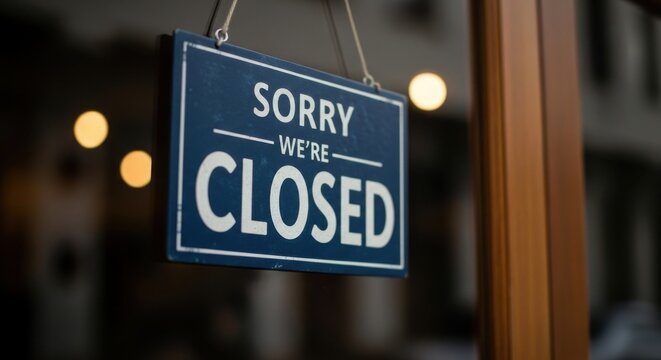 Sorry we are closed sign hanging on a door
