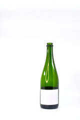 Empty wine bottle with a blank label isolated against a plain white background