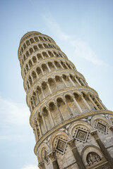 Leaning Tower of Pisa, Italy Photographed at an angle against a blue sky.