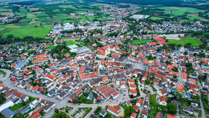 Aerial panoramic view around the old town of the city Geisenfeld, 85290 on a cloudy spring noon in Germany.