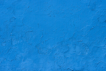 Abstract background of blue damaged plaster.