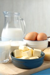 Different dairy products and eggs on table, closeup