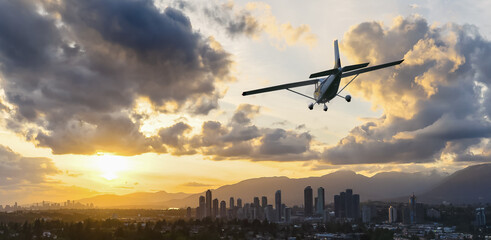 Airplane Flying Over Cityscape During Sunset