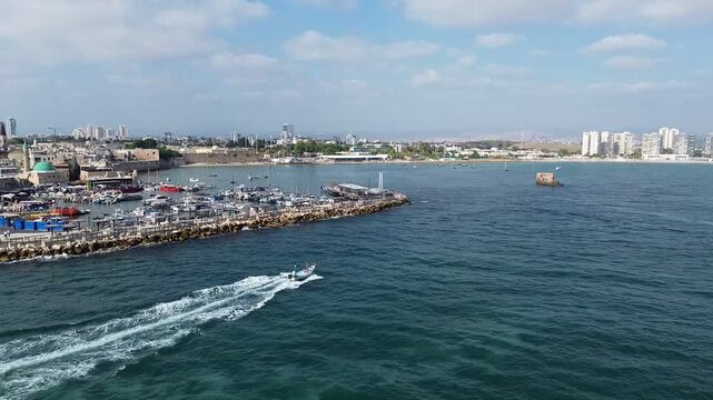 Aerial view of surfing boat on vacation in summer near the Akko city, famous touristic site, Mediterranean sea
Israel