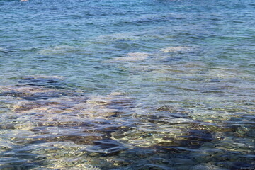 Rocky sea coast with clear turquoise ocean water, Murter, Croatia