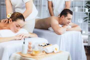 Caucasian couple customer enjoying relaxing anti-stress spa massage and pampering with beauty skin...