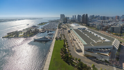 Rooftop view of San Diego downtown waterfront area in bright sun at noon