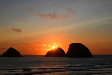Ball of Fire Behind Sea Stacks