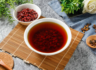 Traditional Sweet Red Bean Soup on Bamboo Mat in Bowl side view of hong kong food
