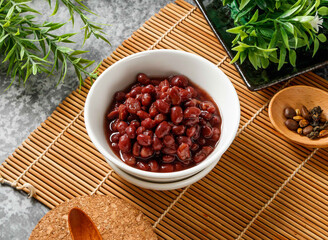 Sweetened Red Beans in White Bowl on Bamboo Mat side view of hong kong food