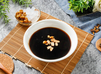 Winter Limited Edition Grass Jelly Dessert with Peanuts, Mung Beans and Coconut Jelly in bowl side view of hong kong food