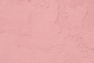 Distressed pink plaster as a background.