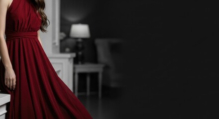 Elegant young caucasian female in red dress posing in stylish interior setting