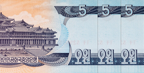 5 Won North Korea banknote 1998 with the image of the Grand Peoples Study House on Mansan Hill in Pyongyang. Money of North Korea.